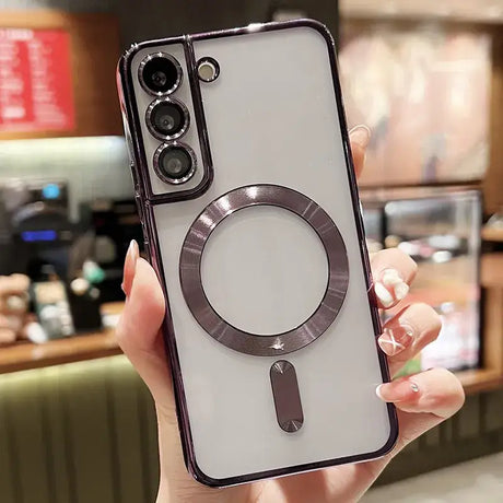 a woman holding a phone case with a ring on it