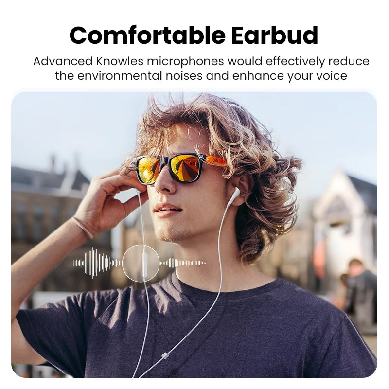 Man wearing earbuds and sunglasses.