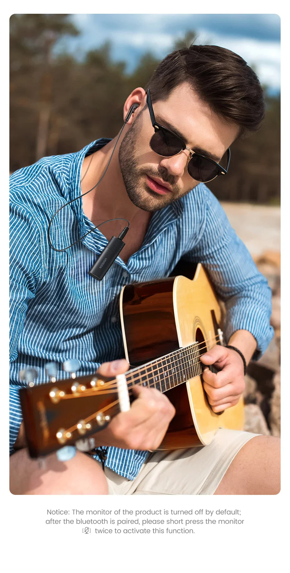 Man playing guitar with wireless earbuds.