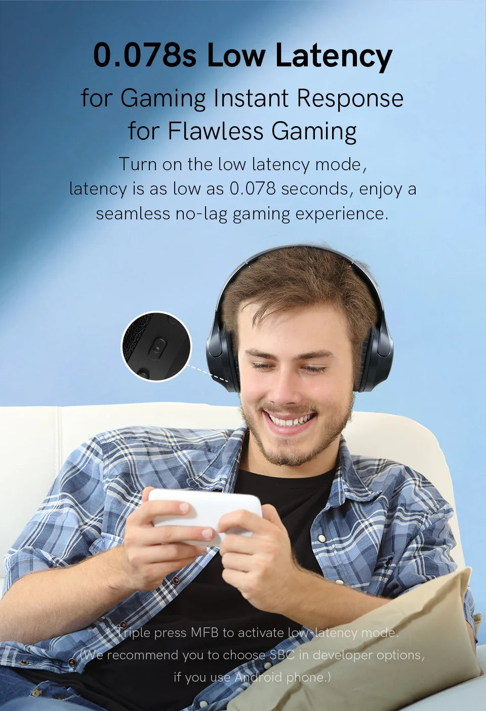 Man wearing gaming headphones playing a mobile game.