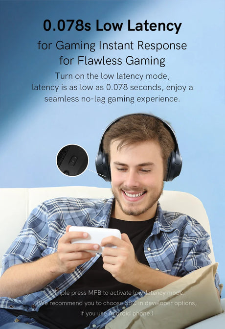 Man wearing gaming headphones playing a mobile game.