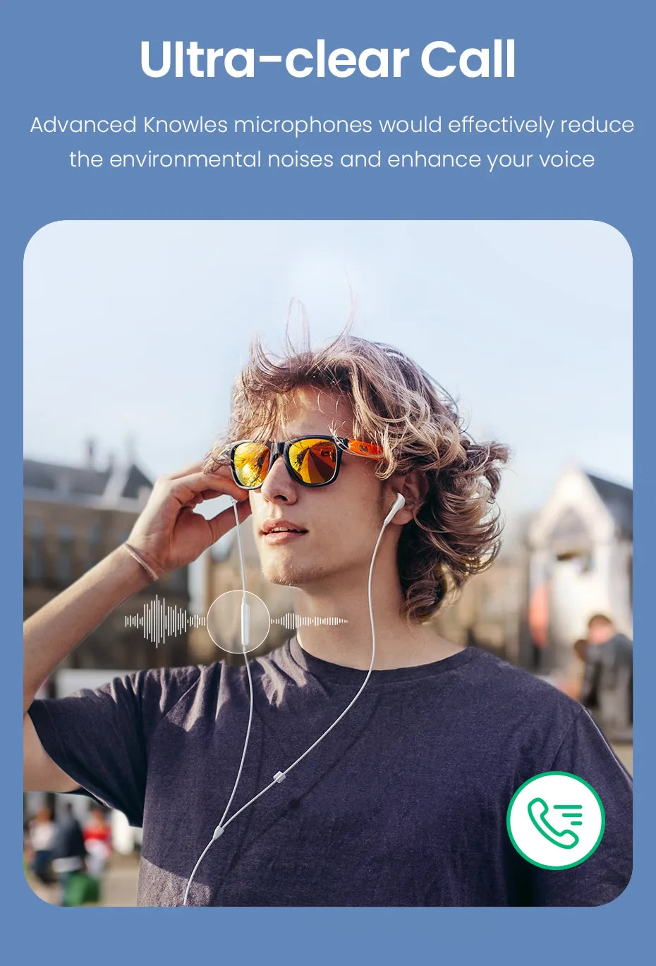 Man wearing sunglasses and wired earbuds.