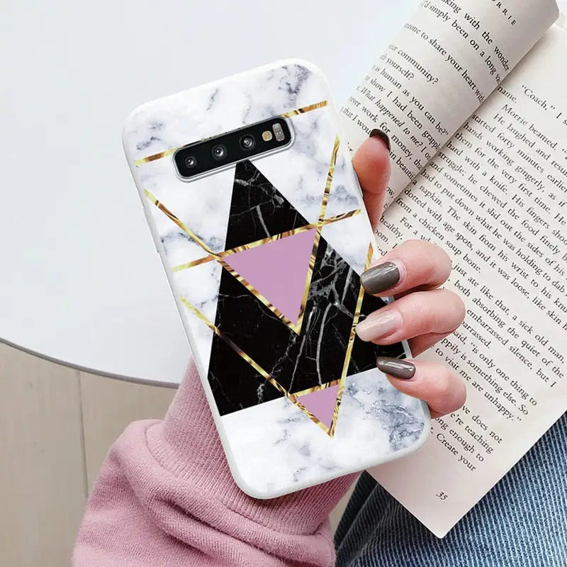 someone holding a phone case with a geometric design on it