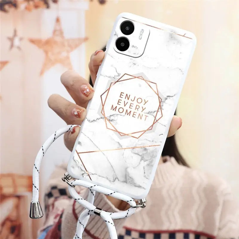 a woman holding a white marble phone case