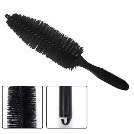 a mascara brush with a black handle