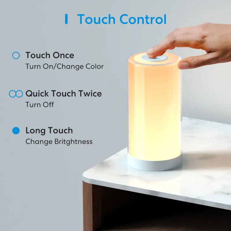 someone is touching the touch control on a lamp on a table