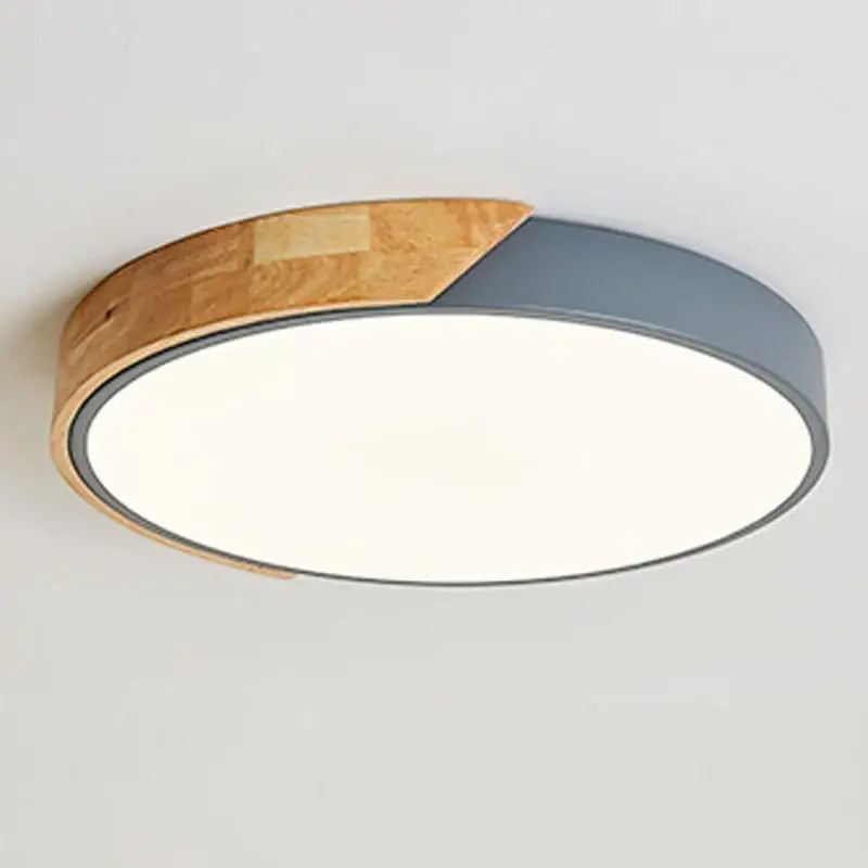 a wooden ceiling light with a white light