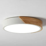 a white ceiling light with a wooden edge