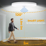 a man walking in front of a wall with a smart light