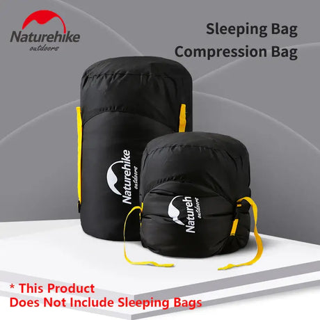 a close up of two bags with a sleeping bag on top