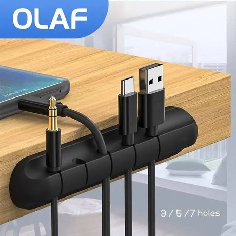 a wooden desk with a charging cable attached to it