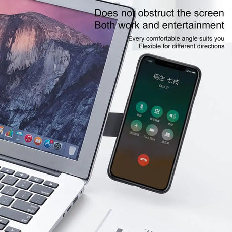 a laptop and a phone on a table