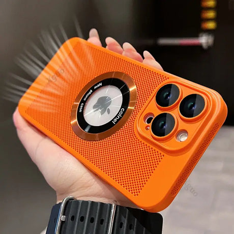 an orange iphone case with a camera attached to it