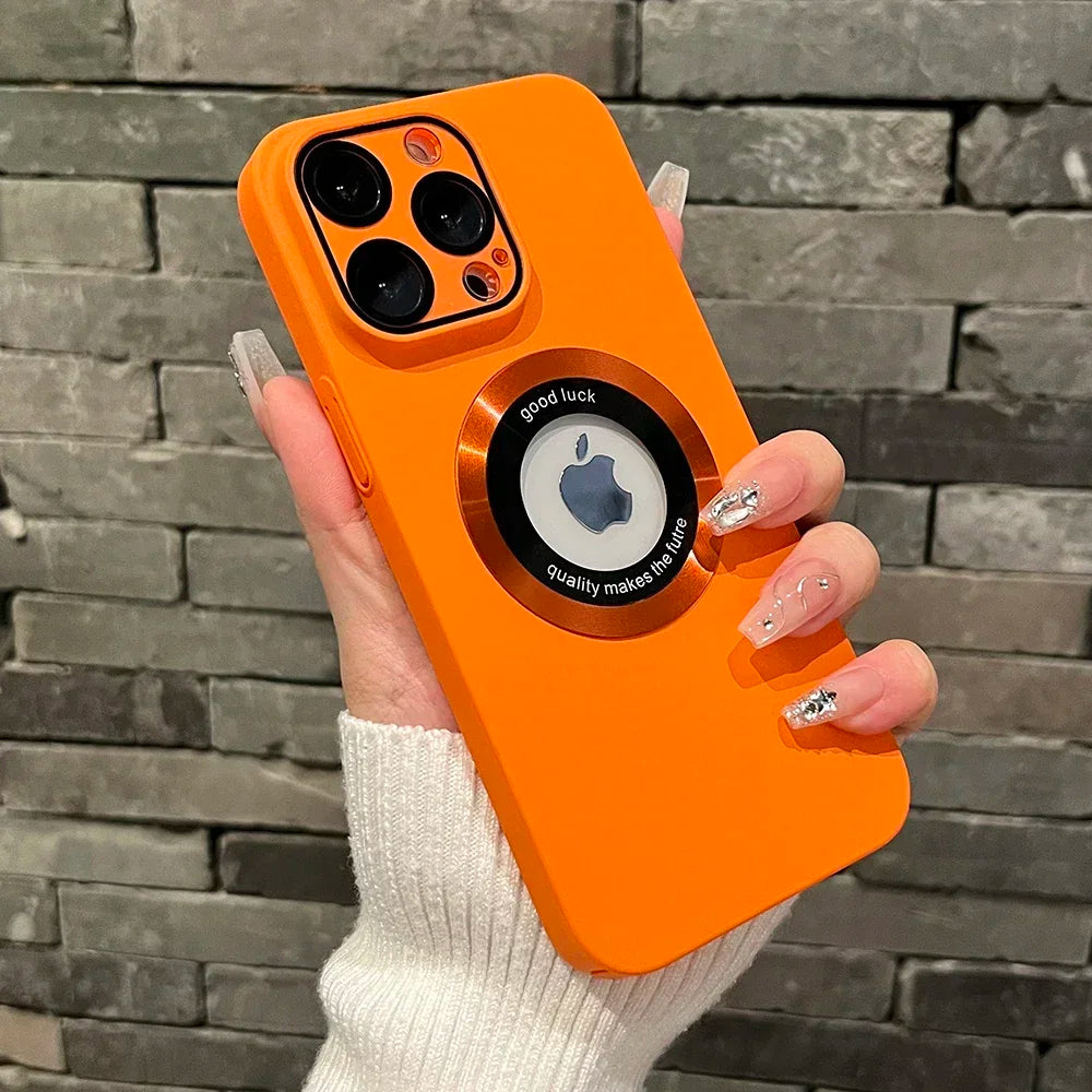 Orange smartphone case with a metal ring and camera lens protectors.