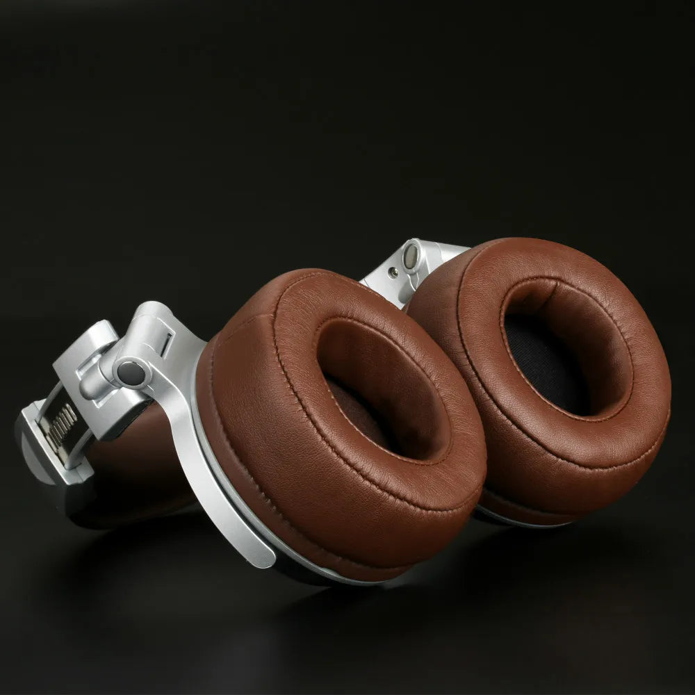 Pair of brown leather headphone ear cushions attached to a metal headband component.