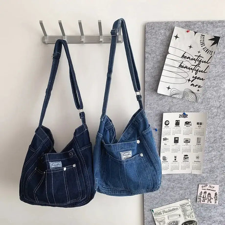 a pair of denim bags hanging on a wall