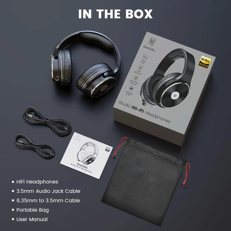 Pair of over-ear wireless headphones with their packaging and accessories.