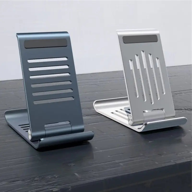 a pair of metal desk stands on a table
