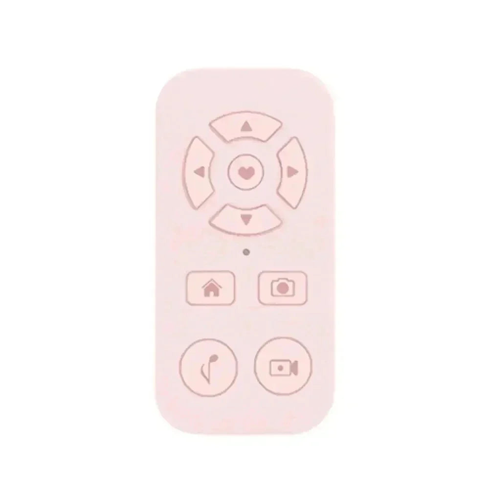 Pale pink remote control with heart-centered directional pad and function buttons.