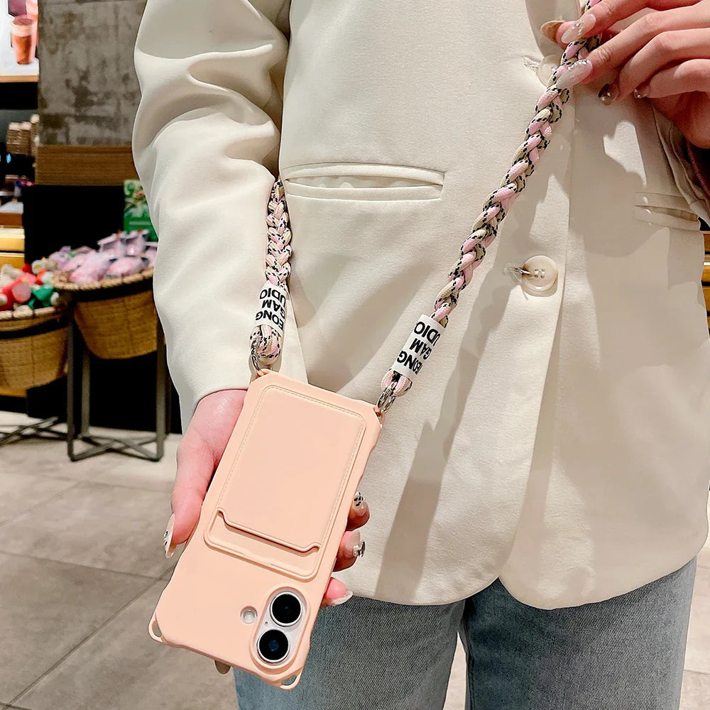 Peach-colored phone case with a braided chain strap.