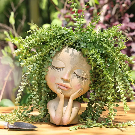 a small fig of a girl with a wreath on her head