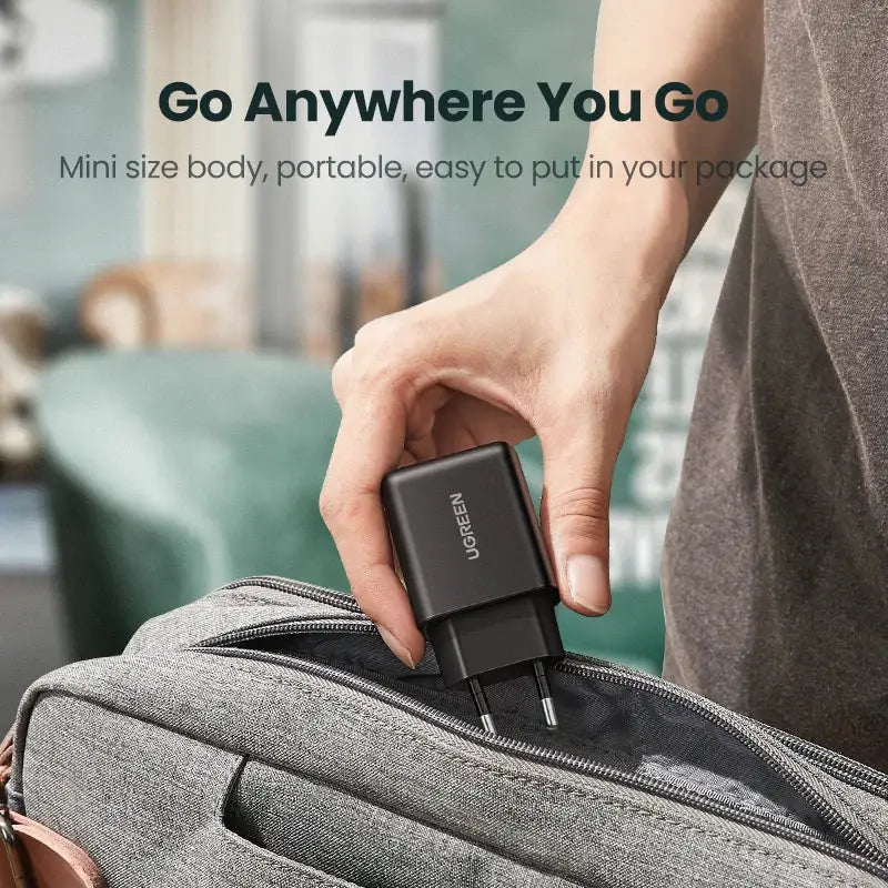 A person holding a bag with a usb attached to it