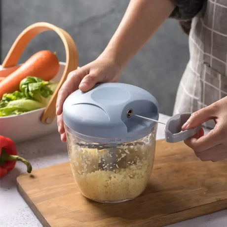 a person is using a blender to make a salad