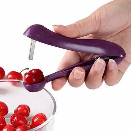 a person is using a cherry peeler to peel cher