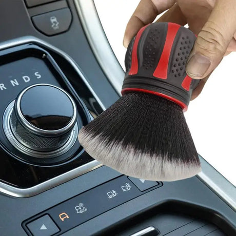 a person holding a brush in their hand