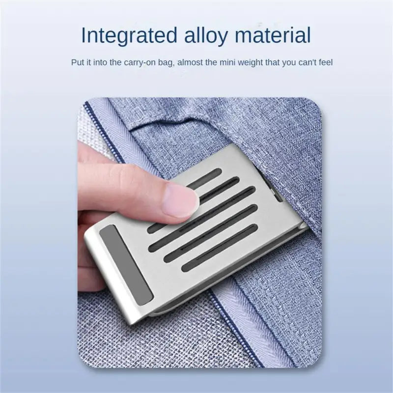 a person holding a metal card in their hand