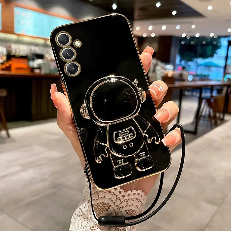 a person holding a cell phone with a camera attached to it