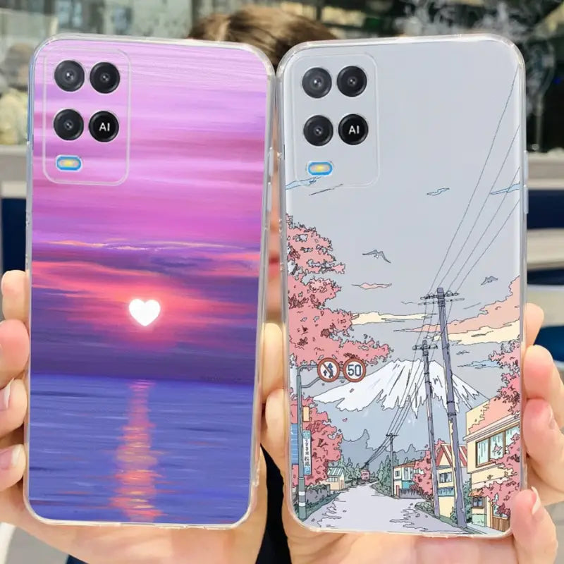 two people holding up their phone cases with a sunset in the background