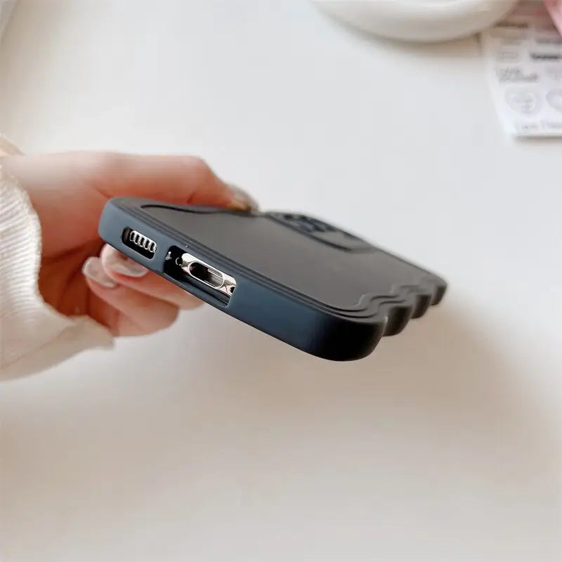 a person holding a cell phone in their hand