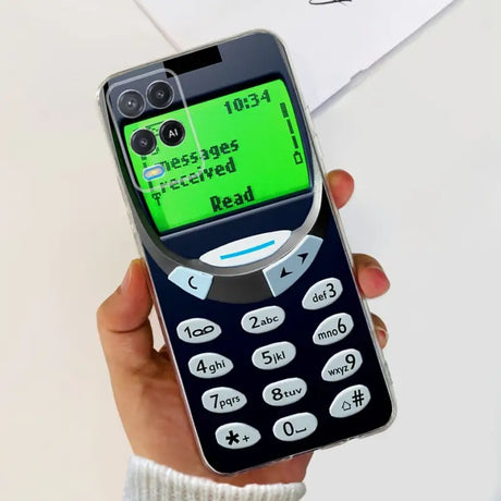 a person holding a cell phone with a green screen