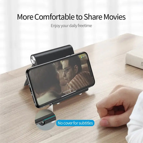 the smart phone holder is attached to a table