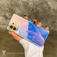 a person holding a clear phone case