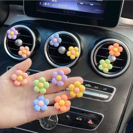 a person holding a car dashboard with colorful balls