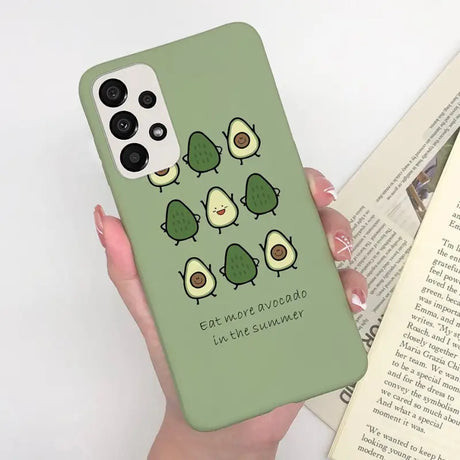a person holding a green phone case with a green background