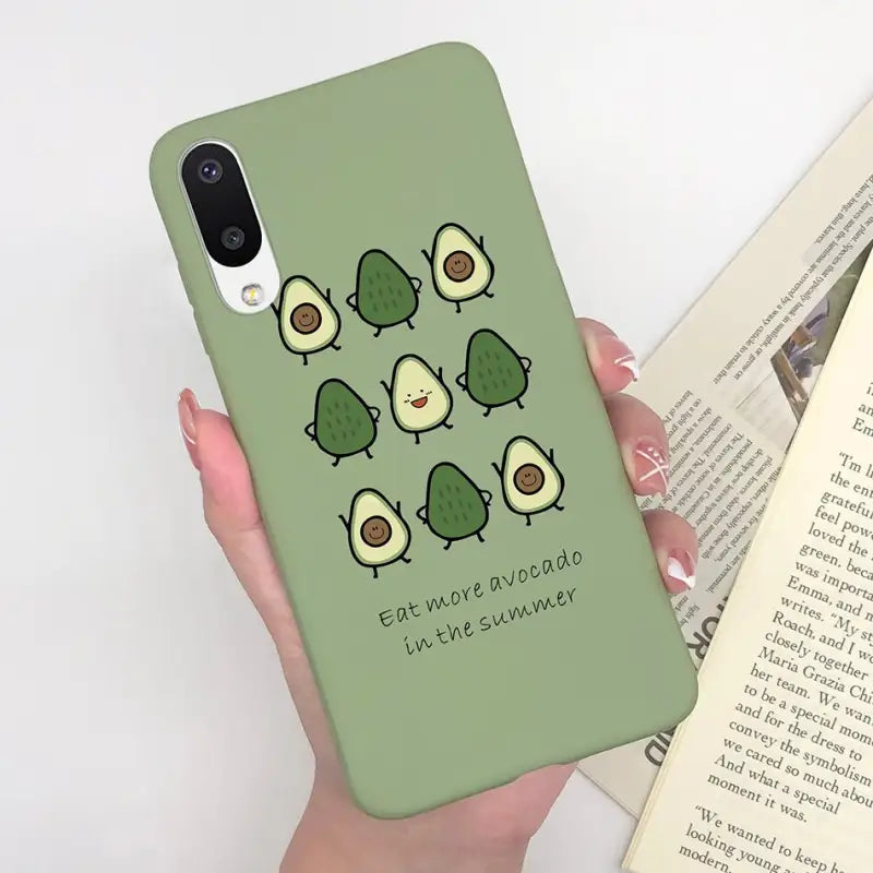 a person holding a green phone case with a green background