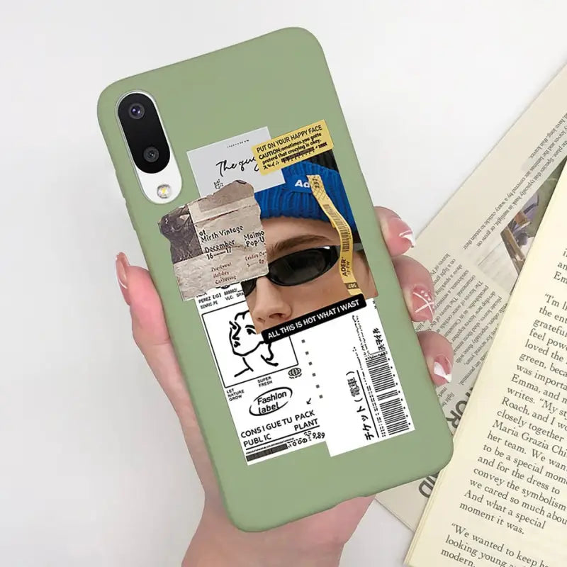 a person holding a book and a phone case
