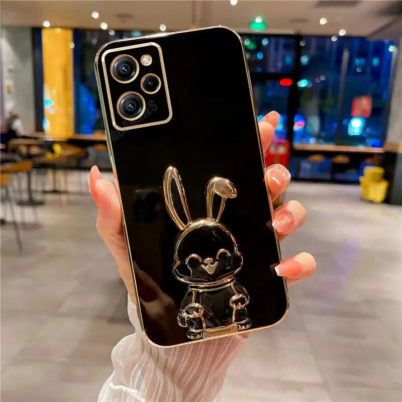 a person holding a phone with a rabbit on it