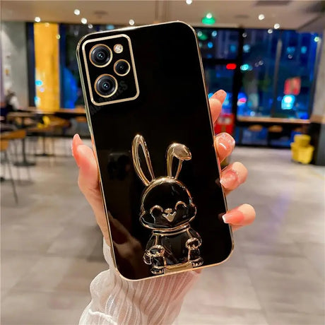 a person holding a phone with a rabbit on it