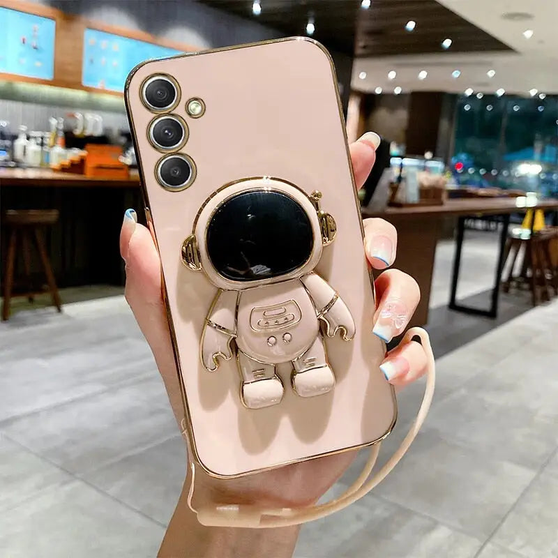 a person holding a phone case with a camera attached to it