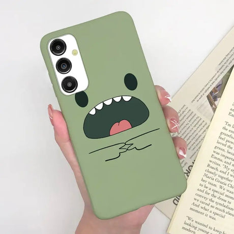 a person holding a book and a phone case
