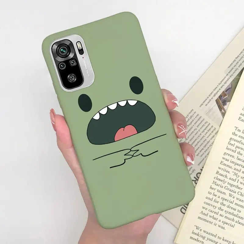 a person holding a book and a phone case