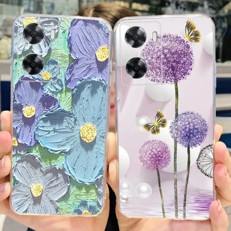 a woman holding a phone case with flowers and butterflies