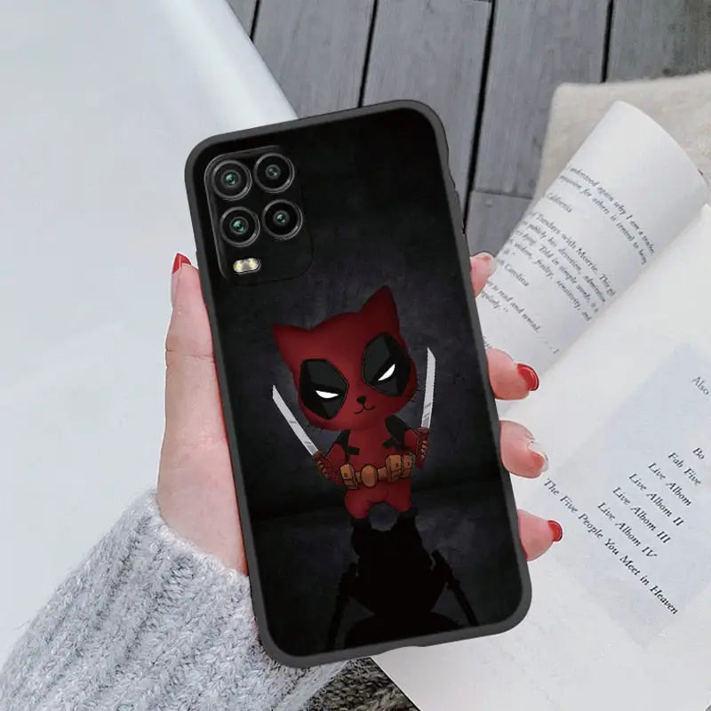 a close up of a person holding a phone case with a deadpool on it