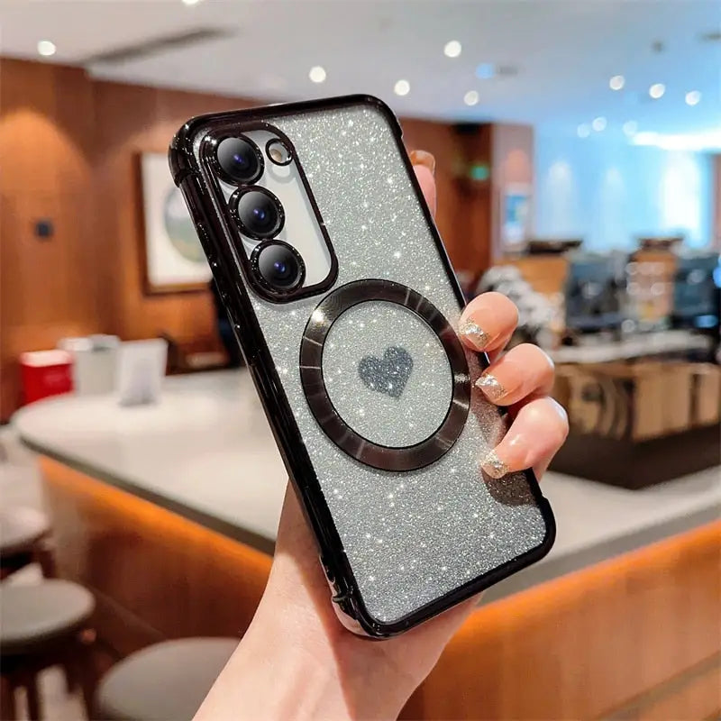 a woman holding up a phone case with a camera