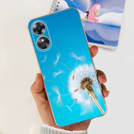 a person holding a phone with a dandel on it