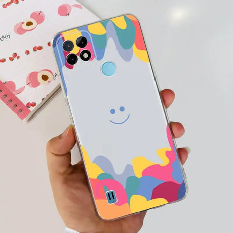 a person holding a phone case with a colorful pattern